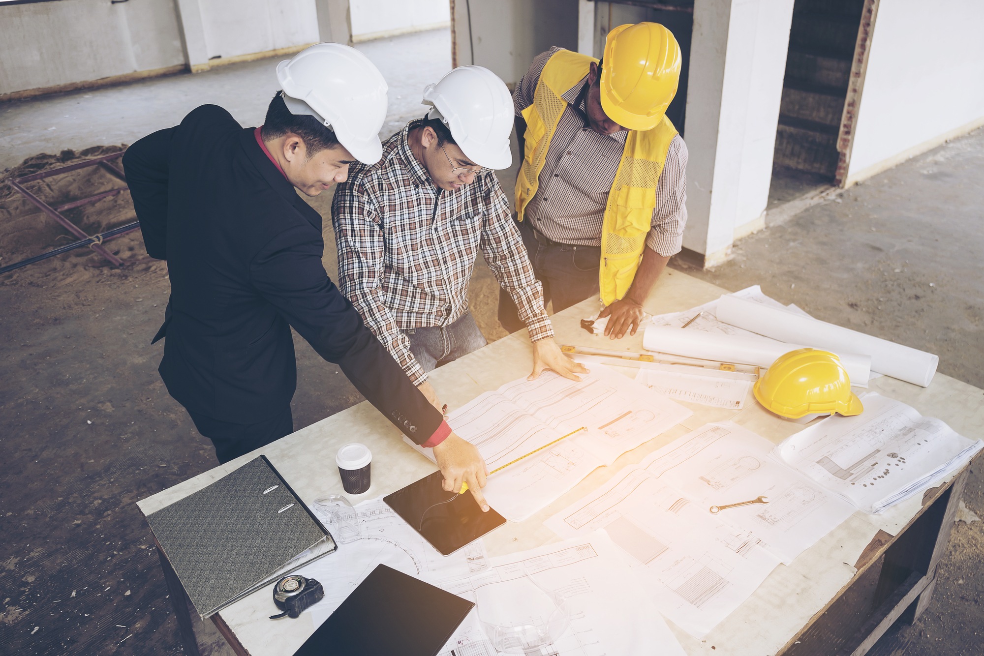 Business people group on meeting and presentation in construction site
