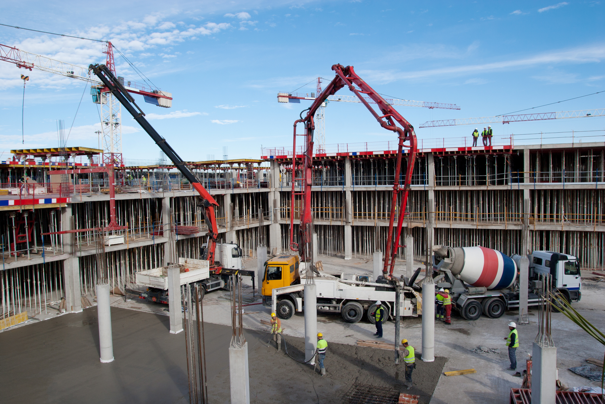 Construction site with cement mixer and blue sky